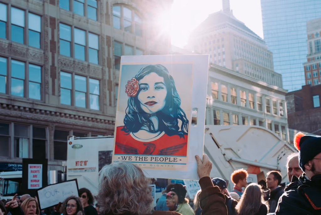 Demonstrators holding handmade placards at a street march.